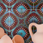 Burgundy Red Blue Symmetrical Geometric Petals Tile<br><div class="desc">This ceramic tile is a captivating piece of artistry, boasting an intricate and symmetrical design that is reminiscent of blooming flowers or kaleidoscopic imagery. The design is dominated by shapes that resemble petals, rendered in rich hues of burgundy and vibrant red. These shapes are outlined with delicate lines, adding definition...</div>