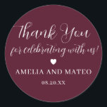Burgundy Red Calligraphy Wedding Thank You Favour Classic Round Sticker<br><div class="desc">The perfect little something to seal your wedding favour box or thank you note. The thank you sentiment is written in a playful script font then your name and wedding date are in a classic serif text. A sweet heart separates them. This item is part of the Elegant Minimalist Wedding...</div>