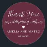 Burgundy Red Calligraphy Wedding Thank You Favour Classic Round Sticker<br><div class="desc">The perfect little something to seal your wedding favour box or thank you note. The thank you sentiment is written in a playful script font then your name and wedding date are in a classic serif text. A sweet heart separates them. This item is part of the Elegant Minimalist Wedding...</div>