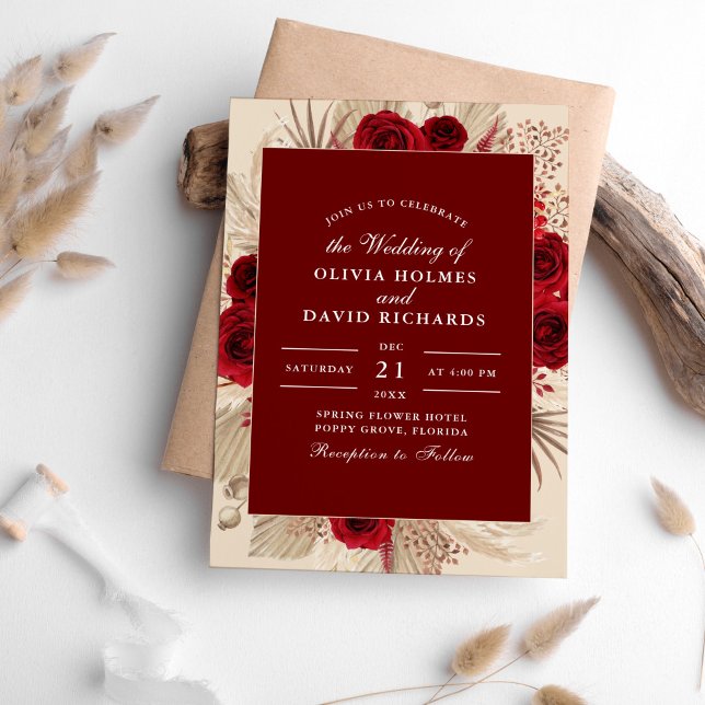 Burgundy Roses and Pampas Grass Wedding Invitation (Burgundy Roses and Pampas Grass Wedding Invitation on table surrounded with pampas grass.)