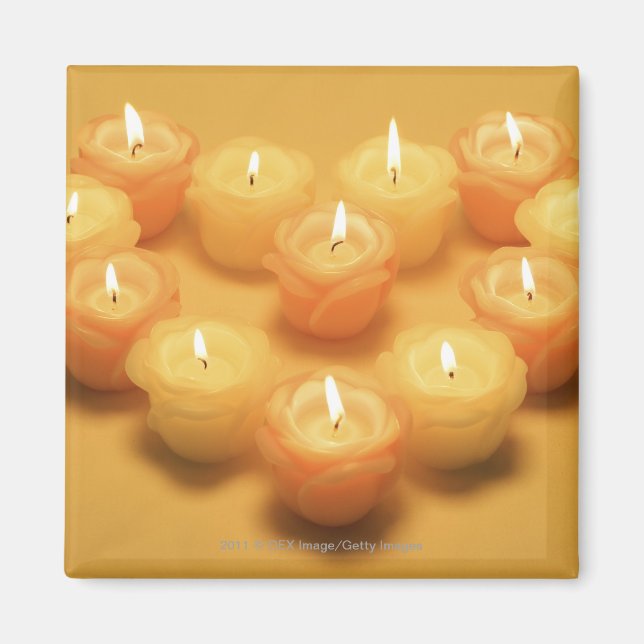 Burning candles arranged in a heart shape magnet (Front)