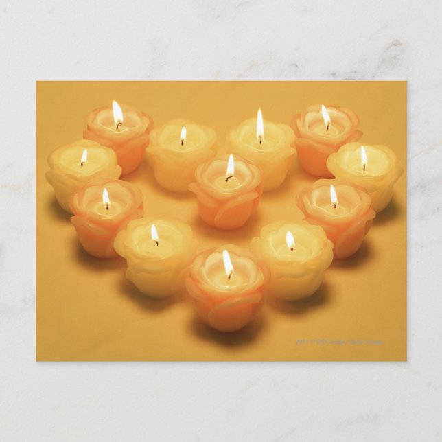 Burning candles arranged in a heart shape postcard (Front)