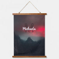 Burning clouds, fog and mountains monogram in sky