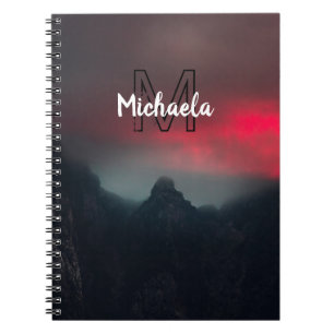 Burning clouds, fog and mountains monogram in sky notebook