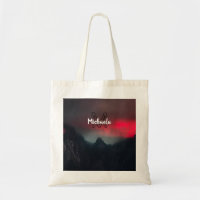 Burning clouds, fog and mountains monogram in sky