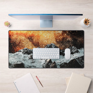 Burning galaxy above majestic mountains desk mat
