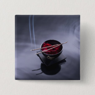 Burning incense on top of bowl of petals 15 cm square badge