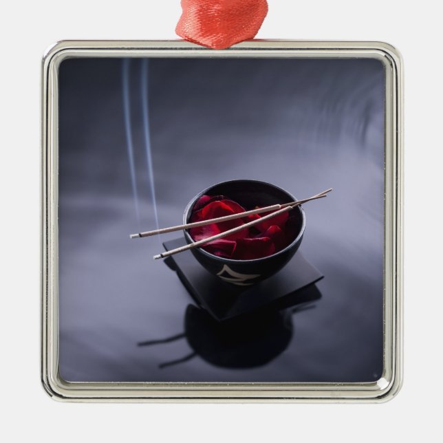 Burning incense on top of bowl of petals metal tree decoration (Front)