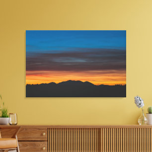 Burning sunset above landscape silhouette canvas print