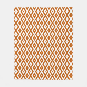 Burnt orange and white diamond pattern fleece blanket