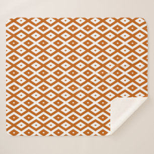 Burnt orange and white diamond pattern sherpa blanket