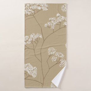 Bushes of small white flowers in beige colour pale bath towel