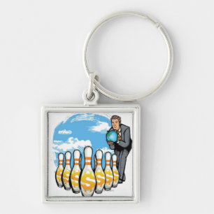 Businessman bowling a globe towards money pins key ring