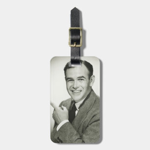 Businessman Pointing Luggage Tag