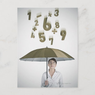 Businesswoman under umbrella with numbers and postcard