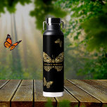 Butterflies black gold name script water bottle<br><div class="desc">Faux gold butterflies on a black background.  Personalise and add your name.</div>