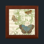 Butterflies on Sheet Music with Floral Design Gift Box<br><div class="desc">A green floral design and sheet music serves as the background to a trio of butterflies in this piece by Vision Studio. The French word for butterfly, papillon, is emblazoned at the bottom of the piece as well. If you have a strong love of butterflies, nature, or just like surrounding...</div>