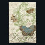 Butterflies on Sheet Music with Floral Design Tea Towel<br><div class="desc">A green floral design and sheet music serves as the background to a trio of butterflies in this piece by Vision Studio. The French word for butterfly, papillon, is emblazoned at the bottom of the piece as well. If you have a strong love of butterflies, nature, or just like surrounding...</div>