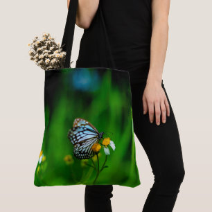 Butterfly on a flower tote bag