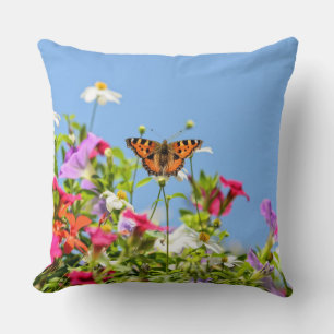 Butterfly on flowers and blue sky cushion