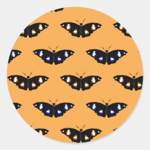 Butterfly pattern on orange background classic round sticker