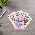 Butterfly pink purple flowers playing cards<br><div class="desc">A girly pink background decorated with a purple butterfly,  pink and purple flowers,  pink confetti. Personalise and add your name.</div>