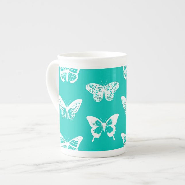 Butterfly sketch, turquoise and white bone china mug (Front Left)