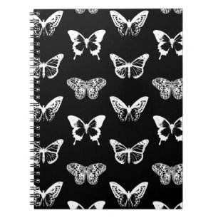 Butterfly sketch, white and black spiral notebook