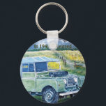Button Key Ring With Land Rover Print<br><div class="desc">"FREYA" The Series1 Truck Cab Key Ring with Wording : In 1948 It Reigned. From a painting by GJLC JackCrisp.co.uk Also available on other Key Ring Styles.</div>