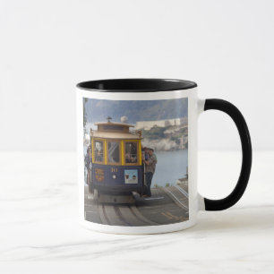 Cable car chugs up Hyde Street in San Mug