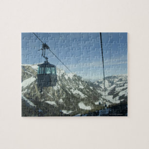 cable cars travelling through snowy mountainous jigsaw puzzle