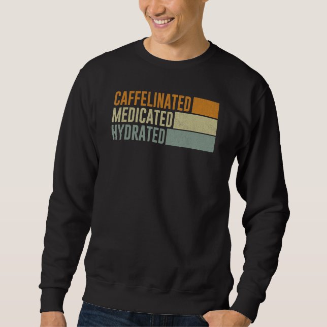 Caffeinated Medicated Hydrated Saying Nurse Sweatshirt (Front)