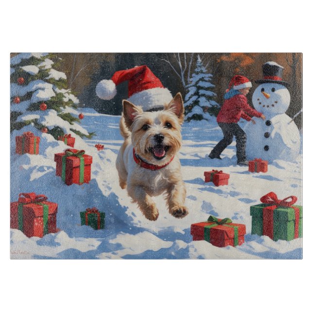 Cairn Terrier Running in Snow with Christmas Hat Cutting Board (Front)
