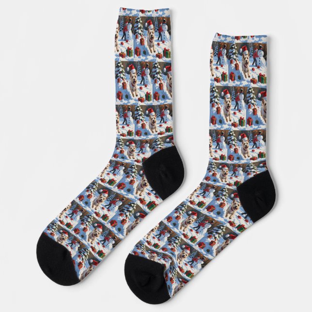 Cairn Terrier Running in Snow with Christmas Hat Socks (Left)