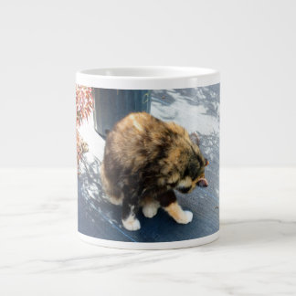 calico cat licking hind legs large coffee mug