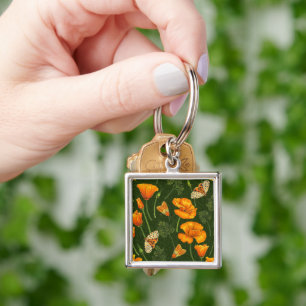 California poppies and moths on dark green key ring