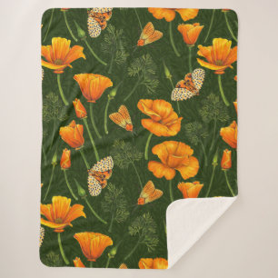 California poppies and moths on dark green sherpa blanket