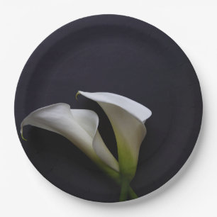 Calla lilies on a dark background paper plate