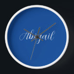 Calligraphy Elegant Blue White Plain Simple Name Clock<br><div class="desc">Looking for a beautiful calligraphy with an aesthetic handwriting? This simple,  eye-catching design is for you. This product immediately impresses those who see it. The fine and tasteful design will immediately reflect the quality of your relationship and family.</div>