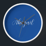 Calligraphy Elegant Blue White Plain Simple Name Clock<br><div class="desc">Looking for a beautiful calligraphy with an aesthetic handwriting? This simple,  eye-catching design is for you. This product immediately impresses those who see it. The fine and tasteful design will immediately reflect the quality of your relationship and family.</div>