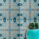 Calming Soft Blue and Indigo Geometric Pattern Tile<br><div class="desc">This ceramic tile showcases a complex kaleidoscopic pattern. The design is symmetrical, featuring abstract shapes that are reminiscent of flowers and geometric figures. The tile is adorned with a soothing palette of various shades of blue, teal, cream, and white, which blend harmoniously to create a visually pleasing effect. The central...</div>