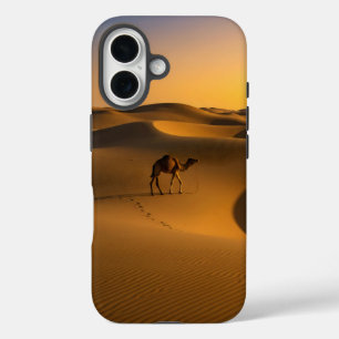 camel walks across the golden sand dunes at sunset iPhone 16 case