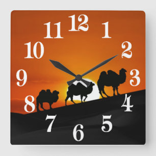 Camels at sunset square wall clock