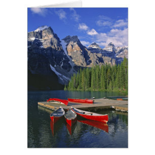Canada, Alberta, Moraine Lake. Red canoes await