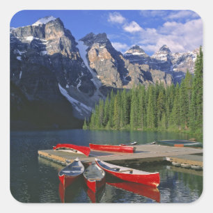 Canada, Alberta, Moraine Lake. Red canoes await Square Sticker