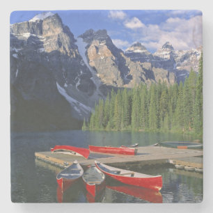 Canada, Alberta, Moraine Lake. Red canoes await Stone Coaster