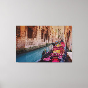 Canal with traditional gondola in Venice, Italy Canvas Print