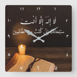 Candle and Quran with bead in dark room Square Wall Clock