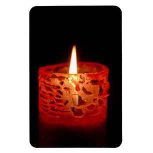 Candle on a black background magnet
