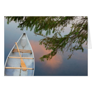 Canoe on lake at sunset, Canada